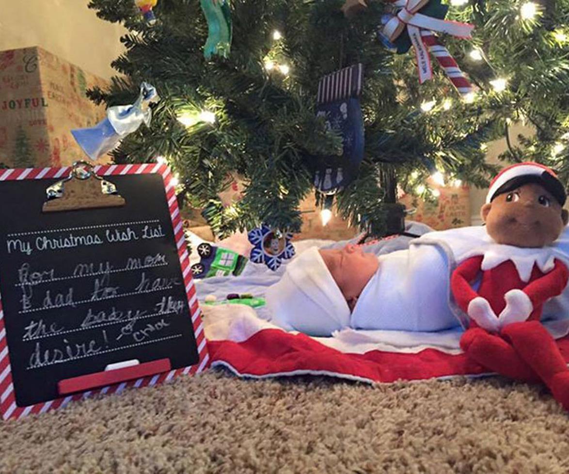 Three sisters are thrilled after finding adopted baby brother under the Christmas tree