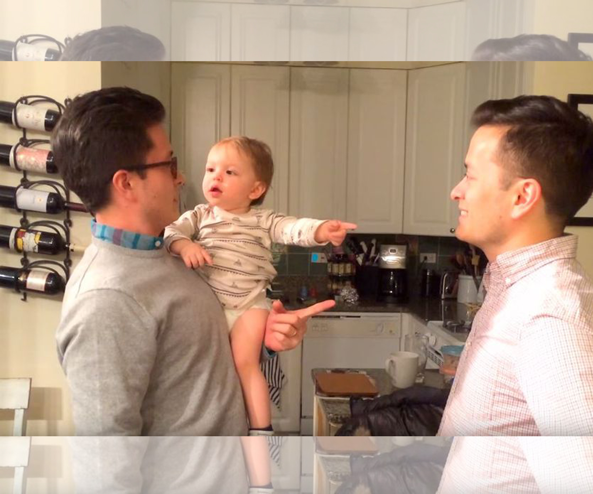 Adorable baby gets confused by twin dad