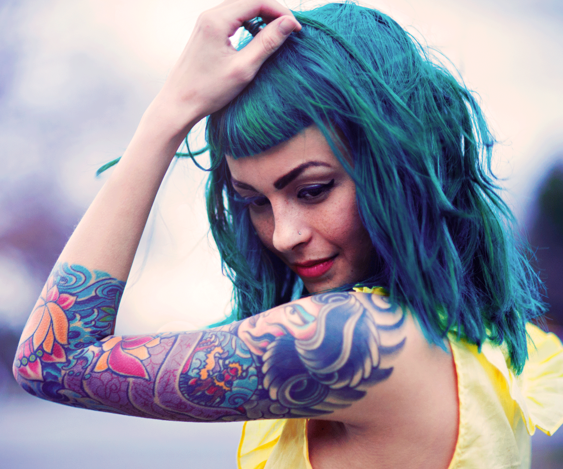 Girl with green hair and tattoos